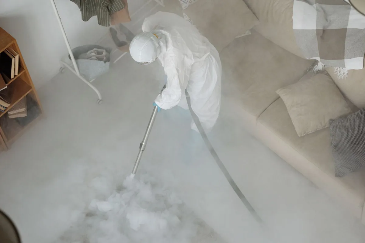 Biohazard cleanup technician in protective equipment, Lake Geneva, WI